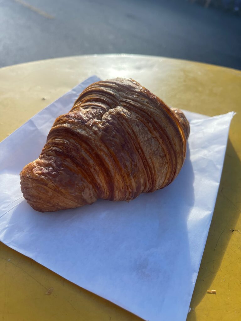 French butter croissant on a napkin on a table