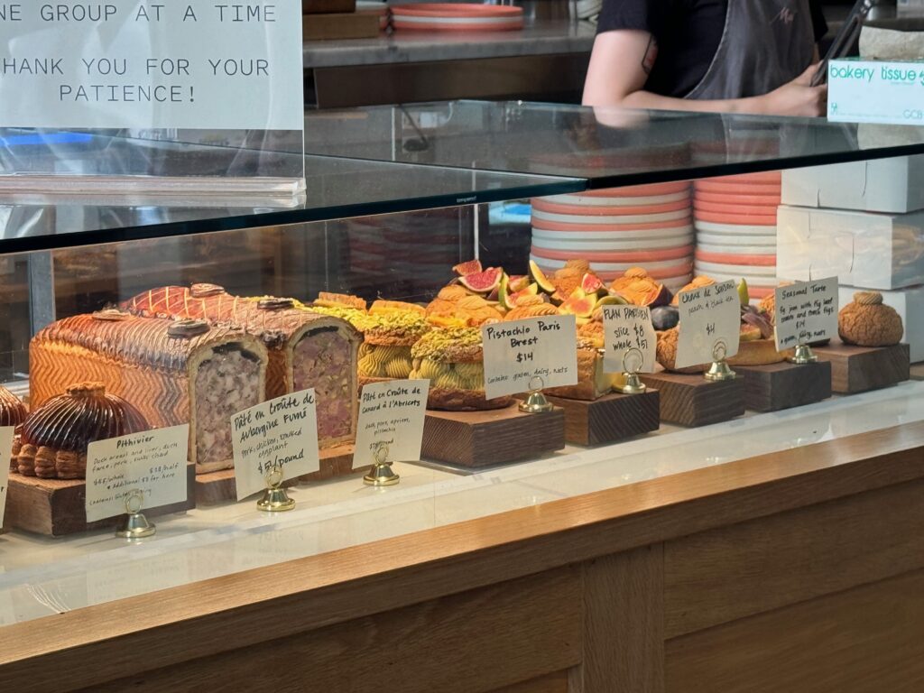 French pastries such as pate en crote within a glass display case