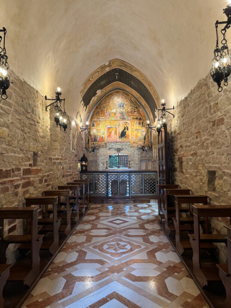 The inside of an Italian Chapel with an altar at the front