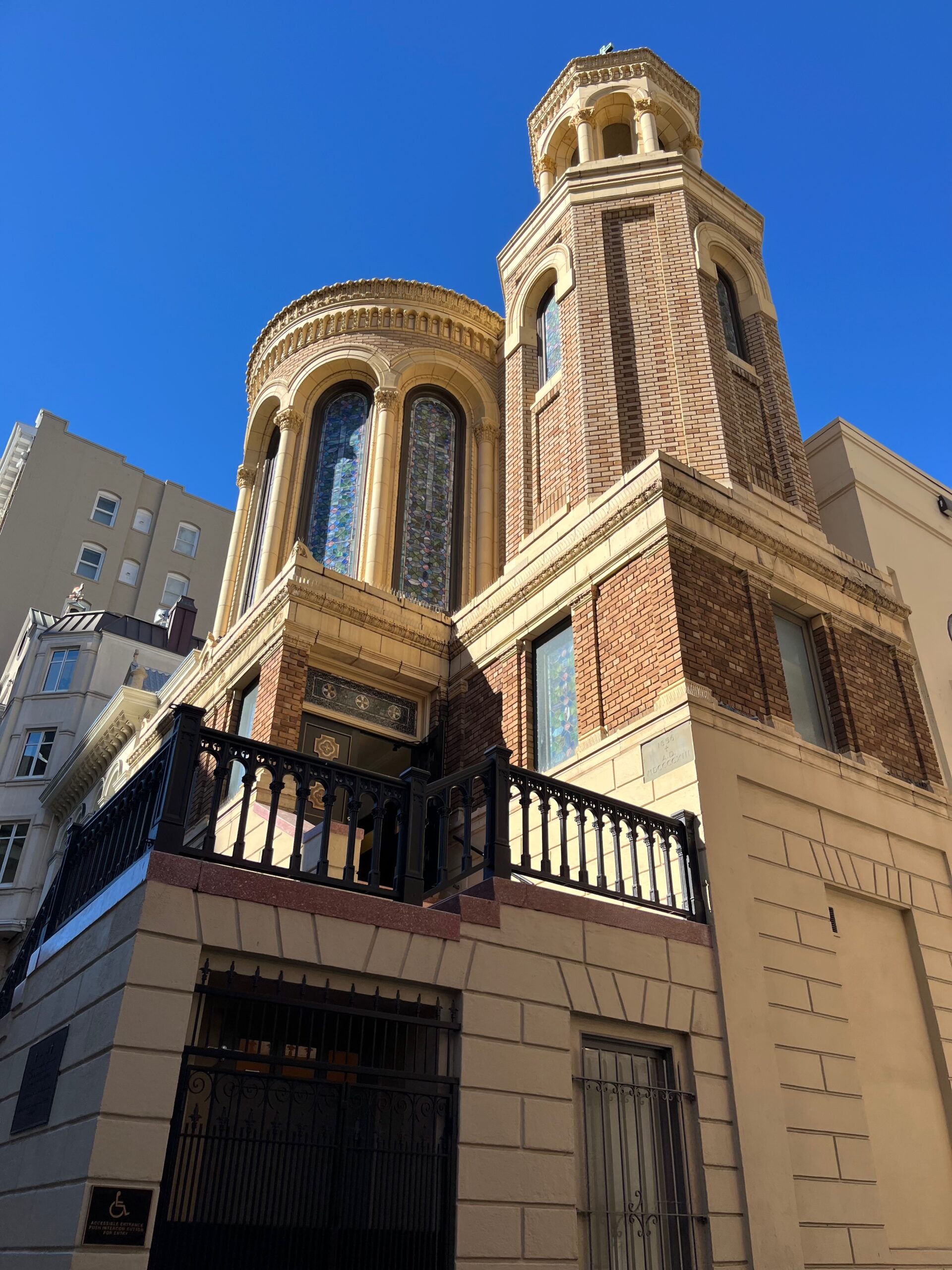 Outside fresco of a Catholic Church in the midst of San Francisco