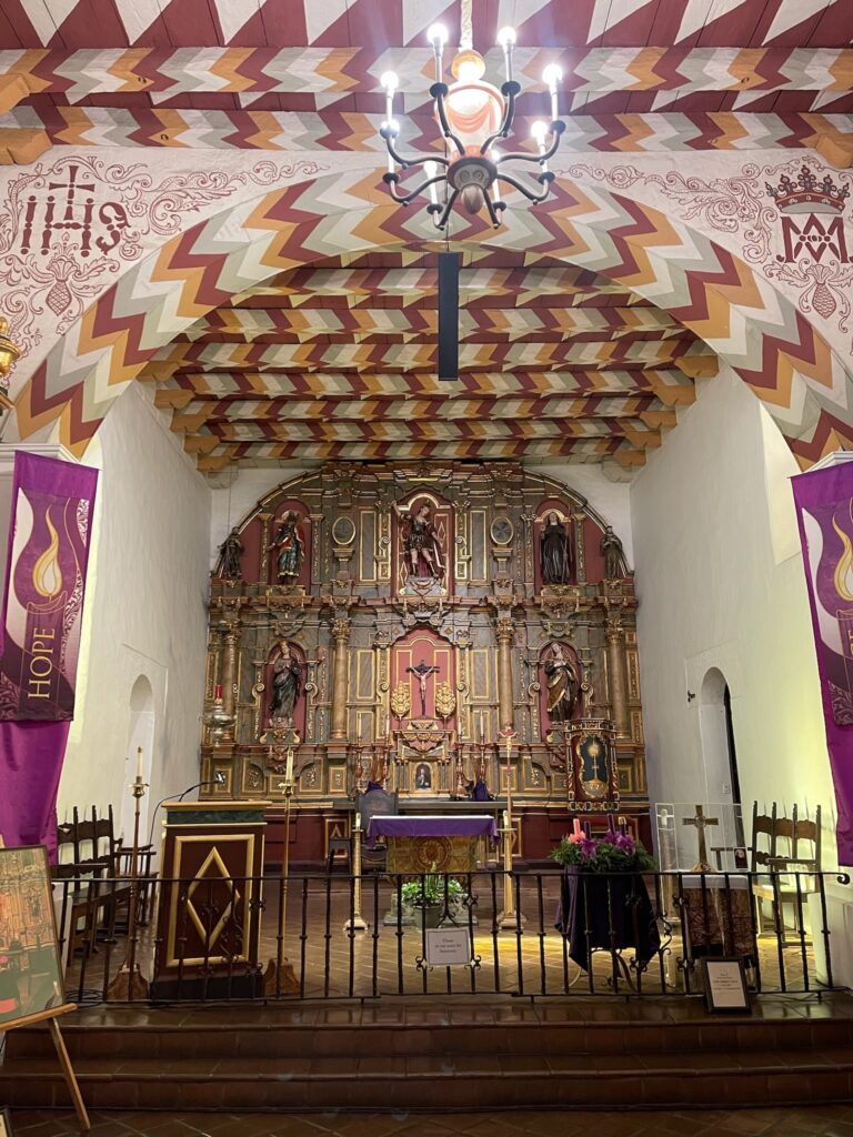 Statuary, baroque altar and painted ceiling of the mission San Francisco de Asis