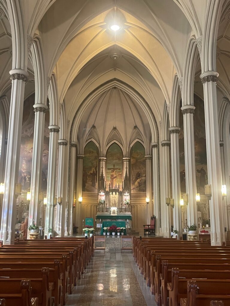Narrow Columns and pews lead to the altar and nave of the Shrine of St. Francis of Assisi