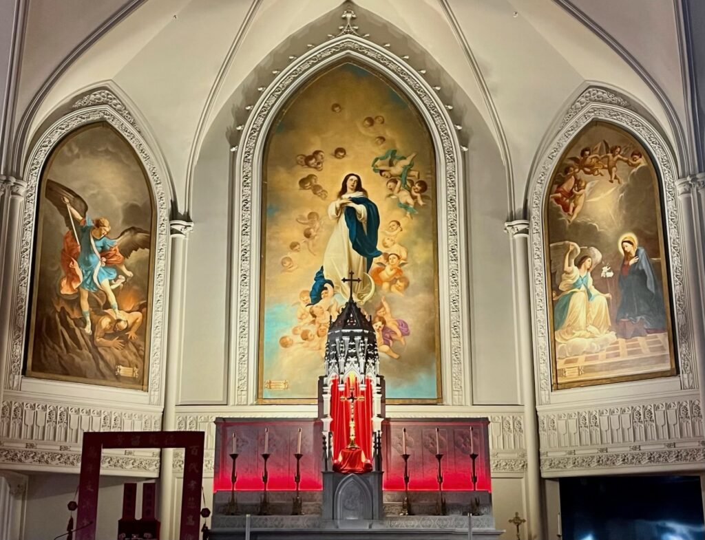 Three murals behind an altar