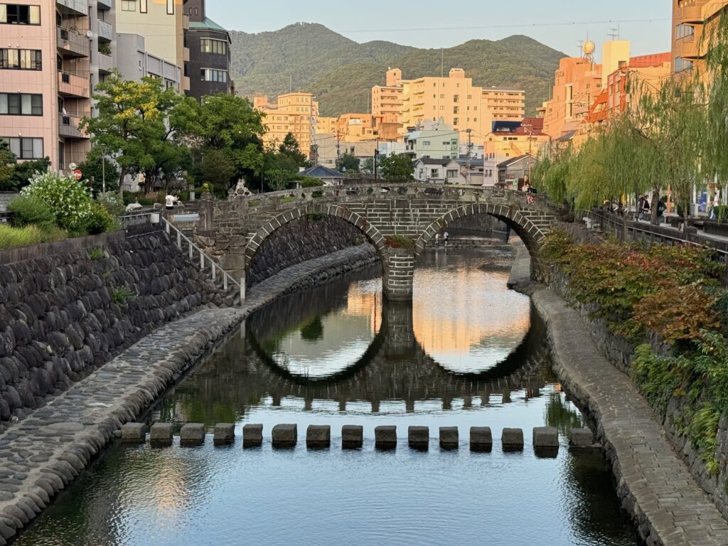 A bridge over a river with its reflection