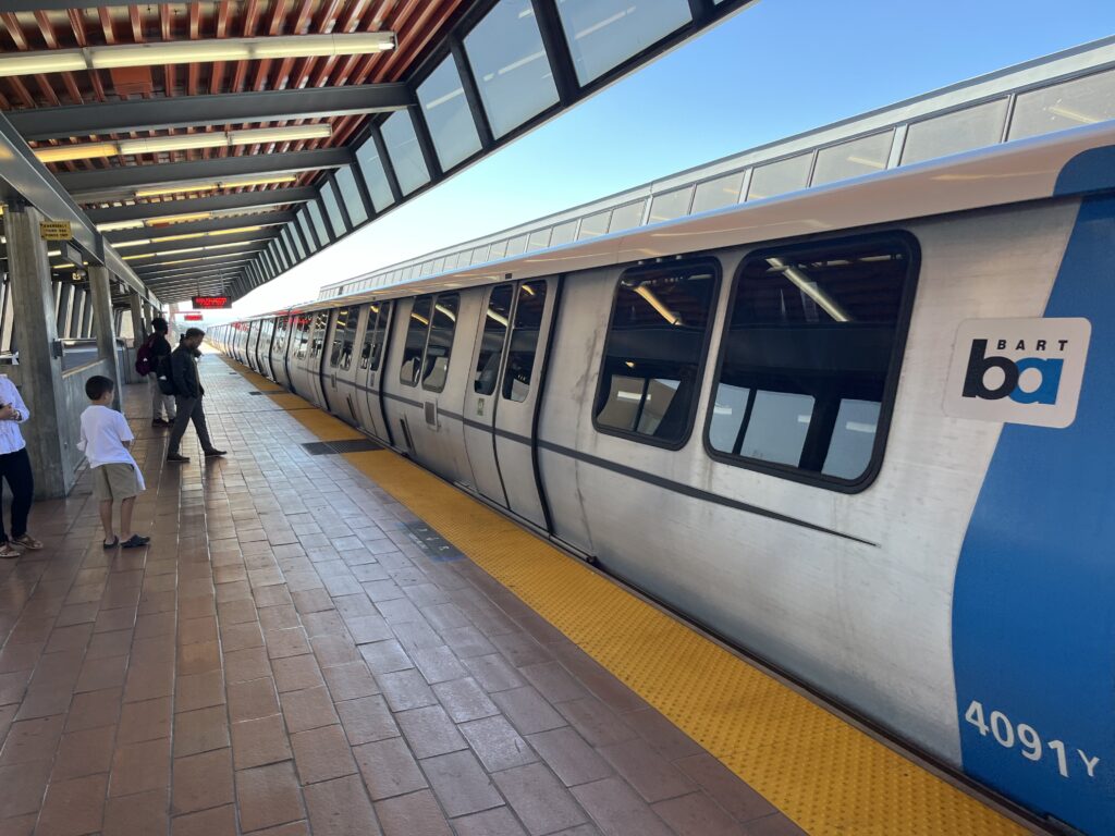 BART commuter train stops at a platform