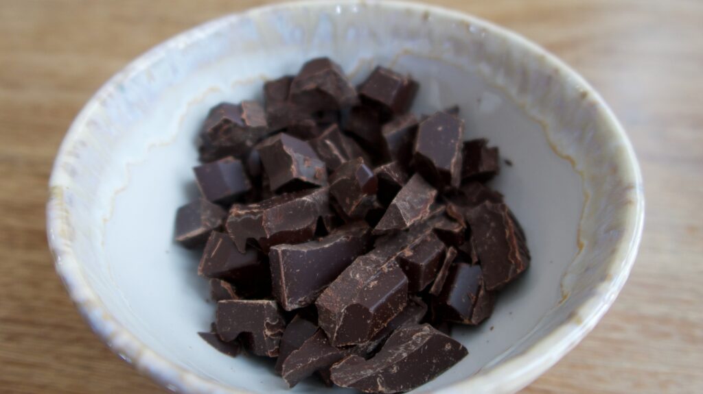 a bowl of chopped dark chocolate