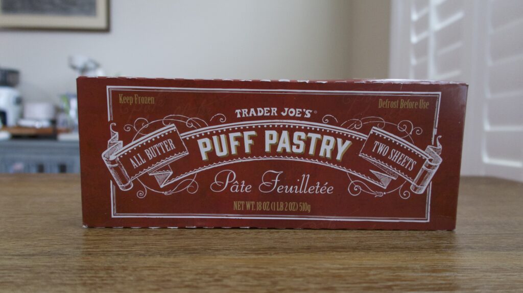 Box of puff pastry from trader joe's on a wooden table