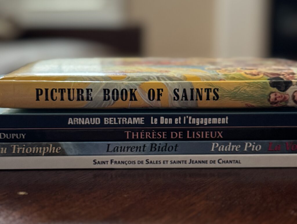 Stack of books about Catholic Saints