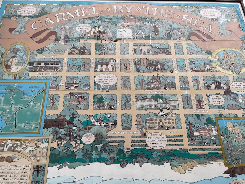 Mural of a map of Carmel by the Sea with significant buildings painted in neutral colors