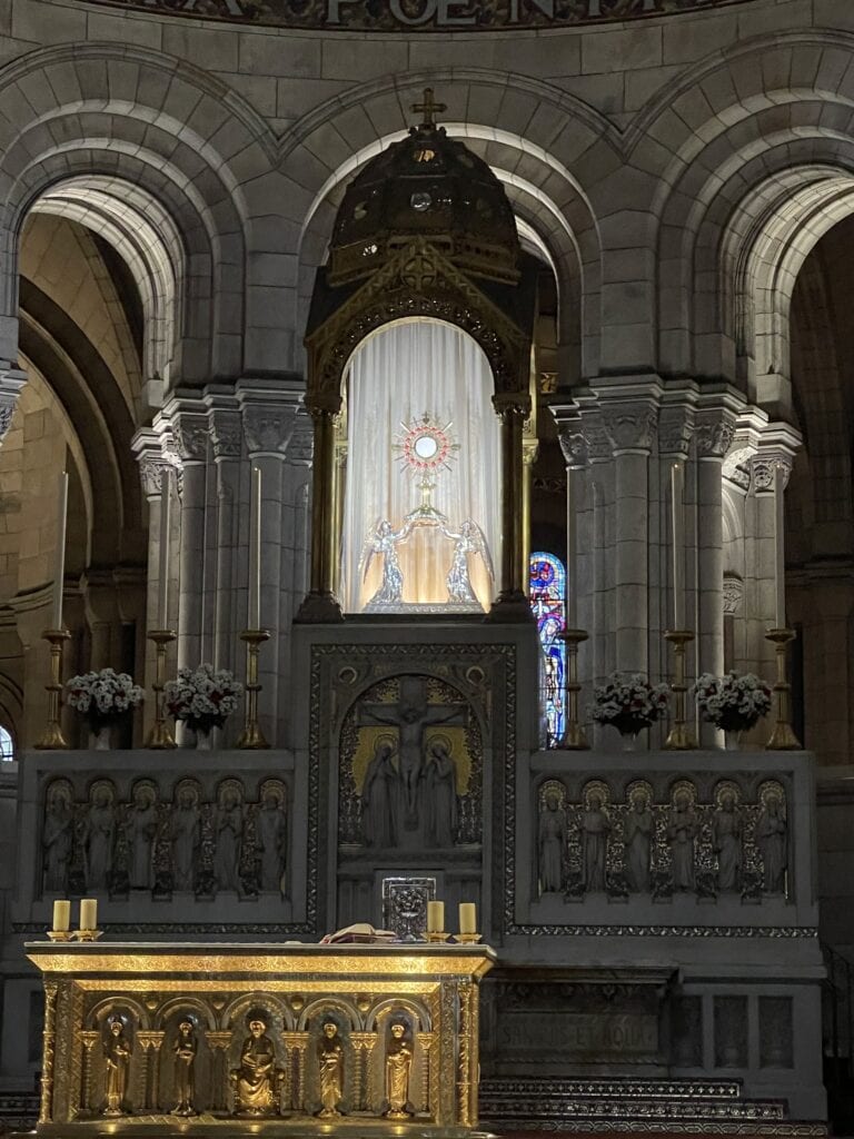 Monstrance above the main altar at Sacré-Cœur Basilica in Paris, where perpetual adoration of the Blessed Sacrament takes place.