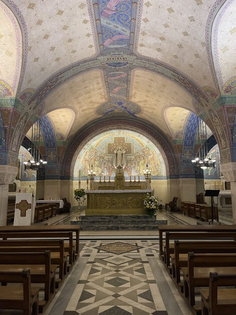 Picture of an altar with mosaics throughout the walls and ceilings