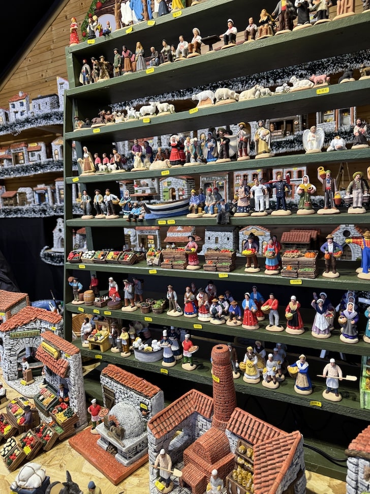 Handmade terracotta figurines displayed on shelves to be sold