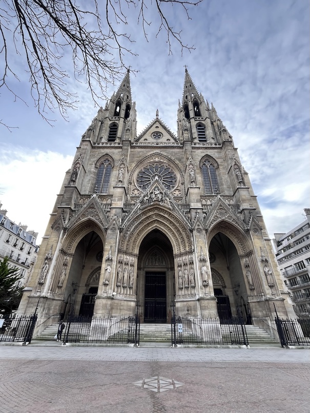 The facade of Saint Clothilde Basilica near the Invalides flanked by twin towers flanking
