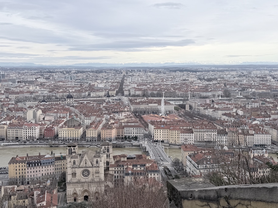 Panoramic view over Lyon from Fourvière hill near the Basilica of Notre-Dame de Fourvière, showing the Saône River and historic city center.