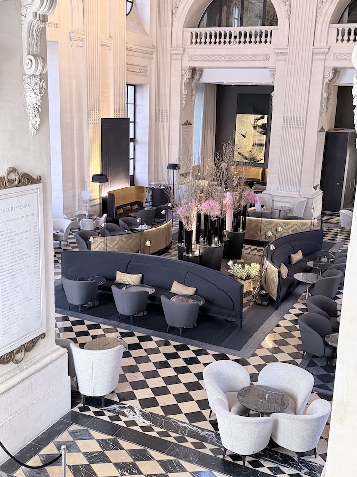 Grand lobby inside InterContinental Lyon Hotel Dieu with historic architecture and modern seating in Lyon, France.