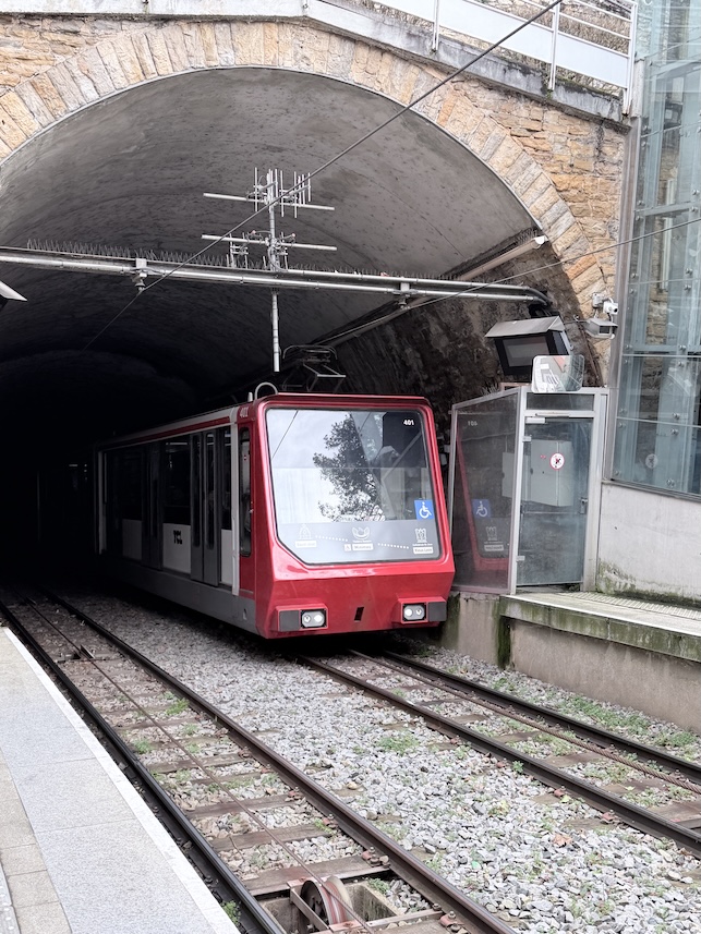 Lyon funicular train entering tunnel near Fourvière hill, a historic public transport system in Lyon, France.