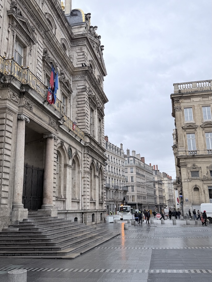 Historic architecture near Hôtel de Ville in central Lyon, France city center street view.