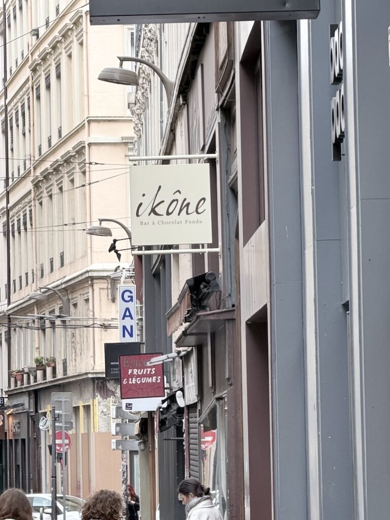 Ikône bar à chocolat fondue storefront sign in Lyon France dessert and chocolate café