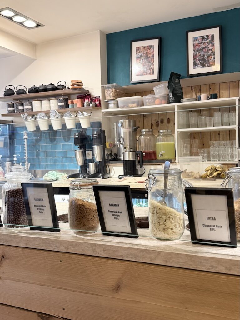 Chocolate fondue toppings bar at Ikône Lyon with nuts chocolate varieties and sweet mix-ins